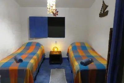 Uma cama ou camas num quarto em Casinha da Curva