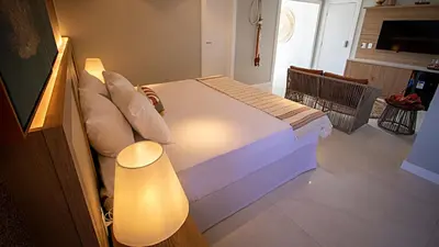 Uma cama ou camas num quarto em Paraiso Beach Hotel