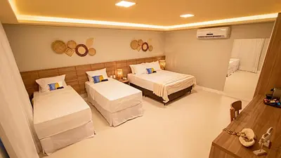 Uma cama ou camas num quarto em Paraiso Beach Hotel