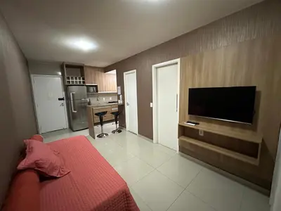 Uma televisão e/ou sistema de entretenimento em VG FUN-OCEAN VIEW BEACH FRONT APARTMENT-Fortaleza