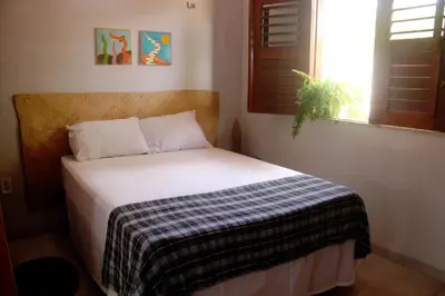 Uma cama ou camas num quarto em Vila Cajoá -lagoa do paraiso