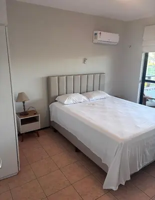 Uma cama ou camas num quarto em Apartamento no Aquaville Resort, do lado da sombra e perto da praia