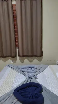 Uma cama ou camas num quarto em Pousada Villa Manduca