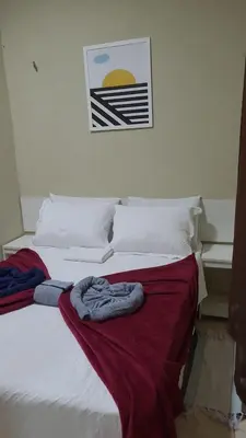 Uma cama ou camas num quarto em Pousada Villa Manduca
