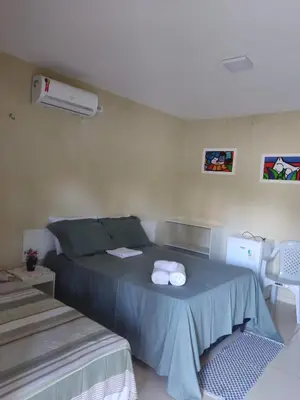 Uma cama ou camas num quarto em Pousada Villa Manduca
