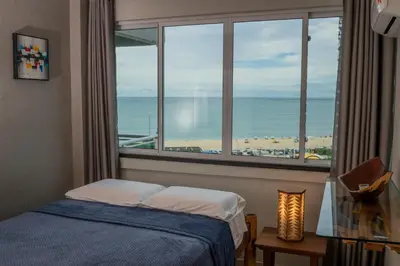 Uma cama ou camas num quarto em Apartamento Vista mar melhor localização da cidade