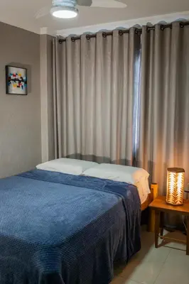 Uma cama ou camas num quarto em Apartamento Vista mar melhor localização da cidade
