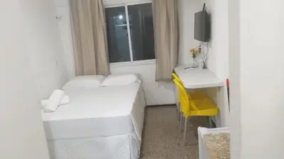 Uma cama ou camas num quarto em 104 Apart mobiliado vista mar Praia de Iracema