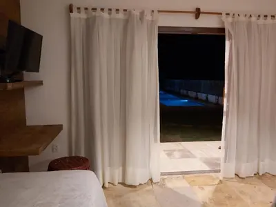 Uma cama ou camas num quarto em Pousada Flor de Lena- Lotus