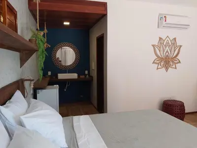 Uma cama ou camas num quarto em Pousada Flor de Lena- Lotus