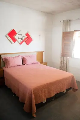 Uma cama ou camas num quarto em Casa perto da Praia Canto da Barra em Fortim CE