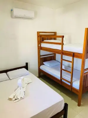 Uma cama ou camas num quarto em Casa do Sol Flecheiras