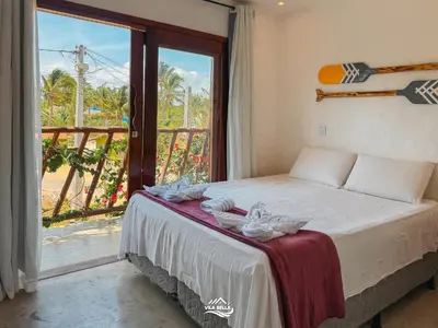 Uma cama ou camas num quarto em Pousada Vila Bella Icaraí