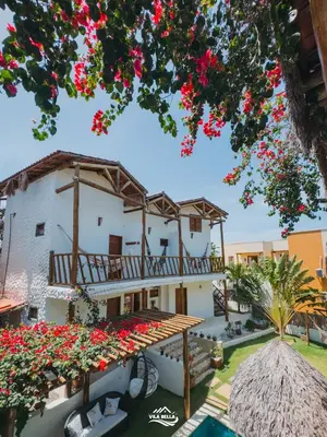 Um jardim no exterior de Pousada Vila Bella Icaraí