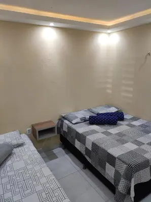 Uma cama ou camas num quarto em Aconchego do Áureo
