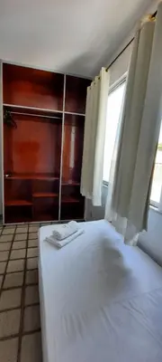 Uma cama ou camas num quarto em Pousada Temporada Atlântica