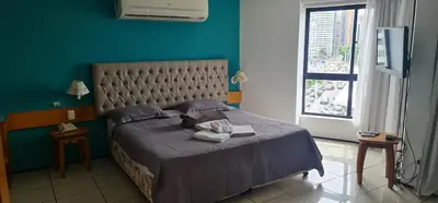 Uma cama ou camas num quarto em IATE PLAZA HOTEL 402