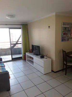 Uma televisão e/ou sistema de entretenimento em Apartamento Residence Praia Porto Iracema