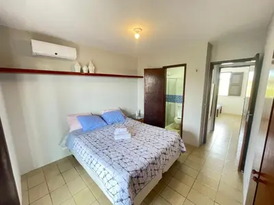 Uma cama ou camas num quarto em casa brisa do mar