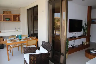 Uma televisão e/ou sistema de entretenimento em Mandara Kauai - Apartamento 3 quartos Porto das dunas