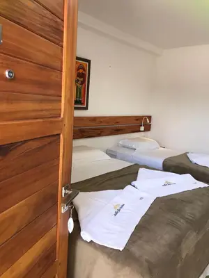 Uma cama ou camas num quarto em Suítes Flecheiras