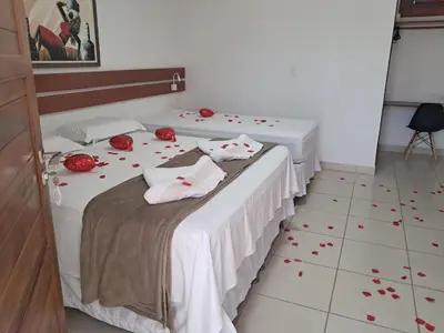 Uma cama ou camas num quarto em Suítes Flecheiras