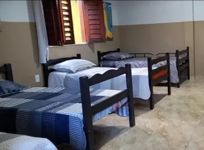 Uma cama ou camas num quarto em Hostel Horizonte Ceará