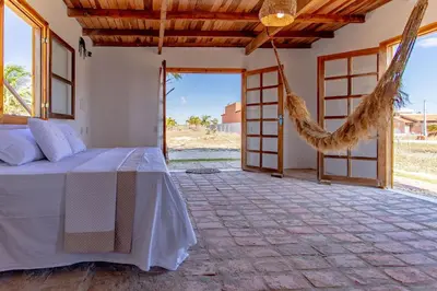Uma cama ou camas num quarto em Bangalô do Vento - Praia do Preá