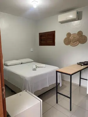Uma cama ou camas num quarto em Viva Praia Flats, maravilhosa hospedagem na praia!