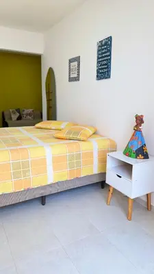 Uma cama ou camas num quarto em Lounge Pdd - Espaço inteiro