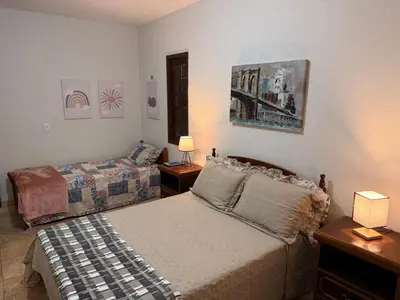 Uma cama ou camas num quarto em Sítio São Gerardo - Aconchegante casa no campo.