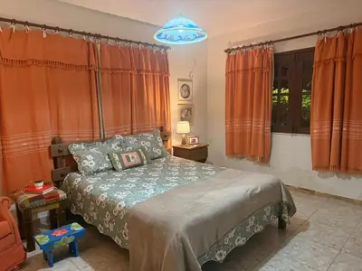 Uma cama ou camas num quarto em Sítio São Gerardo - Aconchegante casa no campo.