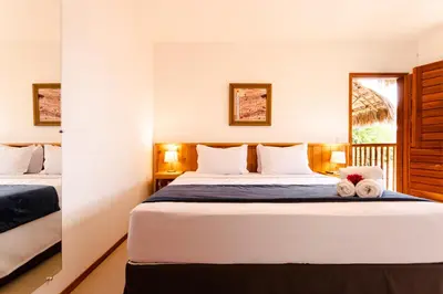 Uma cama ou camas num quarto em UNKUÉ POUSADA FLATS