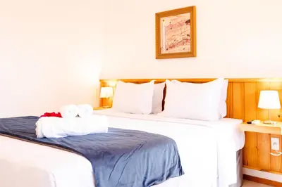 Uma cama ou camas num quarto em UNKUÉ POUSADA FLATS