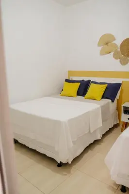 Uma cama ou camas num quarto em Studio à 400m mar,cozinha completa, wi-fi 95mbs ideal para casais