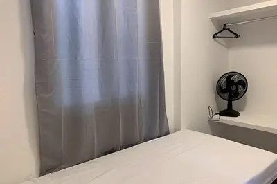 Uma cama ou camas num quarto em Hosts BR - Apartamentos funcionais