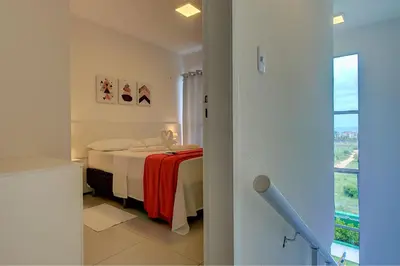Uma cama ou camas num quarto em Beach Townhouses #C7 - Com jacuzzi by Carpediem