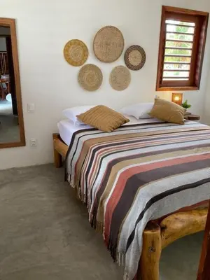 Uma cama ou camas num quarto em CASA SOLEIL icaraizinho
