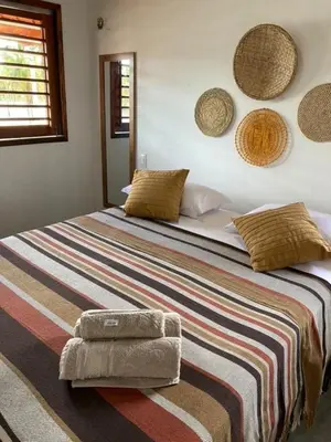 Uma cama ou camas num quarto em CASA SOLEIL icaraizinho