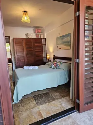 Uma cama ou camas num quarto em Apartamento pé na areia Cumbuco