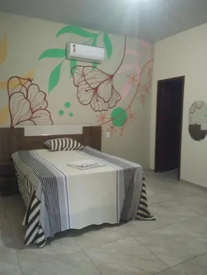 Uma cama ou camas num quarto em Vila São Miguel