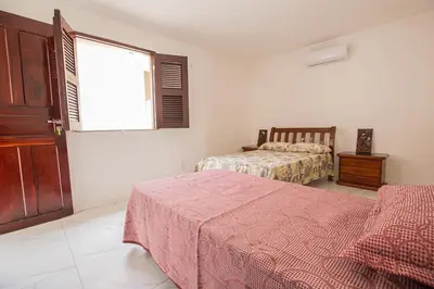 Uma cama ou camas num quarto em Porto das Dunas Casa Temporada Estilo e Conforto 2