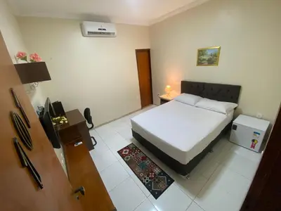 Uma cama ou camas num quarto em Bertolini Hotel