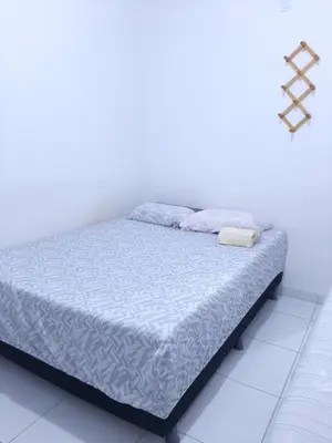 Uma cama ou camas num quarto em Cantinho arretado da Peste - Apartamento