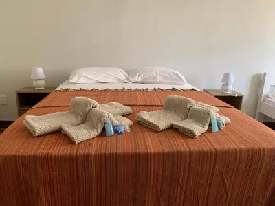 Uma cama ou camas num quarto em Casa do Sol Fortaleza
