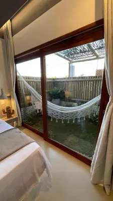 Uma cama ou camas num quarto em Piticcaia Lodge - Casa pé na areia, Frente mar - PREÁ