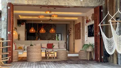 Uma área de estar em Piticcaia Lodge - Casa pé na areia, Frente mar - PREÁ