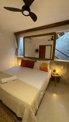 Uma cama ou camas num quarto em Piticcaia Lodge - Casa pé na areia, Frente mar - PREÁ