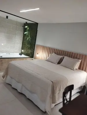 Uma cama ou camas num quarto em HOTEL KICHARME PONTAL