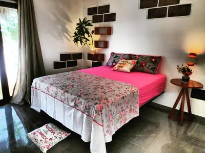 Uma cama ou camas num quarto em Anacardium